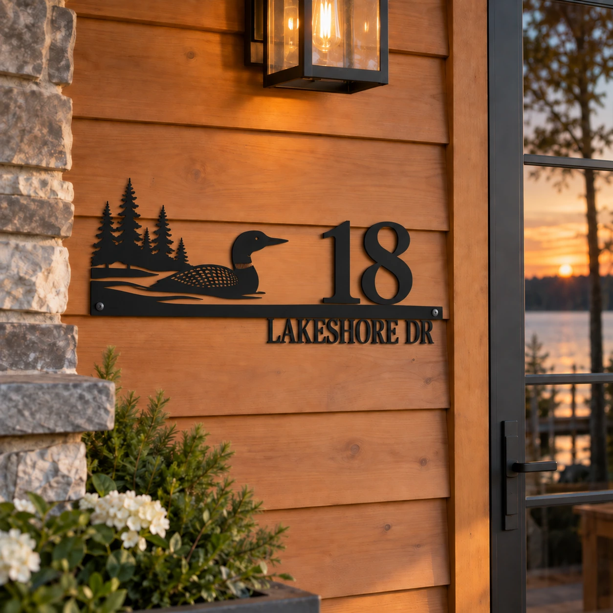 18 Lakeshore Drive loon and lake metal address sign at a warm lakeside cottage