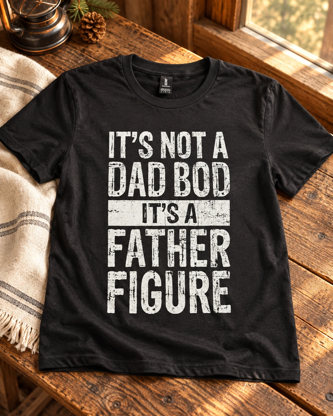 Not a dad bod its a father figure t-shirt displayed in a warm styled setting