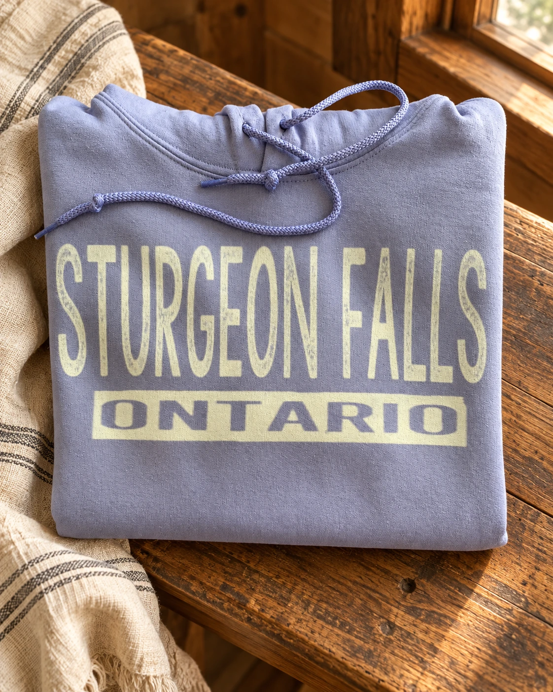 Sturgeon Falls Hoodie or T-Shirt displayed in a warm styled setting