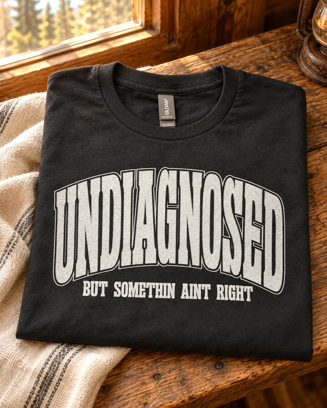 Undiagnosed but something aint right t-shirt displayed in a warm styled setting