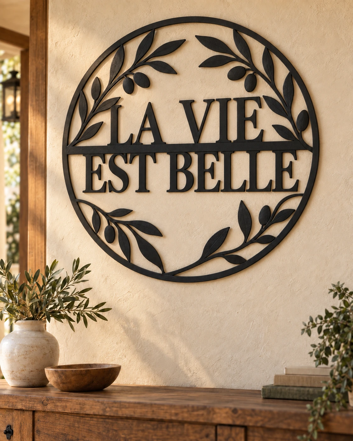 La Vie Est Belle black metal sign in a warm rustic home setting